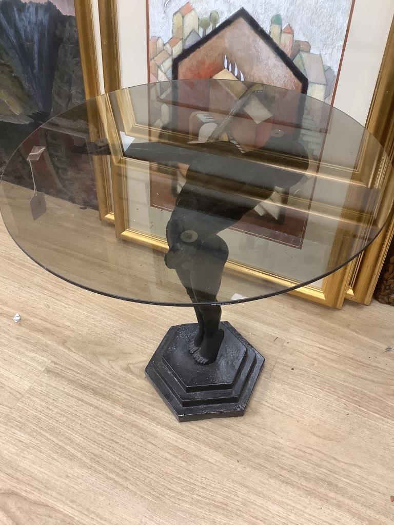 An Art Deco style occasional table with a figural metal female base, base height 60cm glass top diameter 60cm